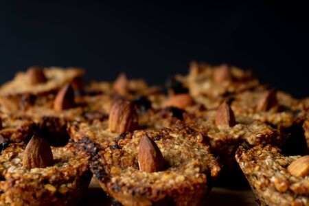 Homemade vegan cookies made of oats, banana and chocolate. Decorated with an almond. Cookie pattern.の写真素材
