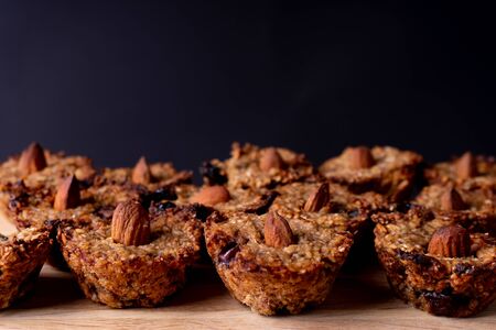 Homemade vegan cookies made of oats, banana and chocolate. Decorated with an almond. Cookie pattern.の写真素材