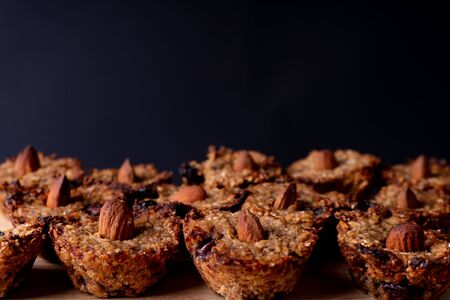 Homemade vegan cookies made of oats, banana and chocolate. Decorated with an almond. Cookie pattern.の写真素材