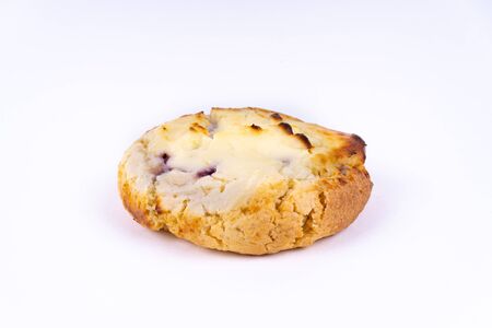 A cookie cheesecake with blueberries on white background with copy space - angled viewの写真素材