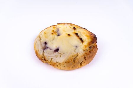 A cookie cheesecake with blueberries on white background with copy space - angled viewの写真素材