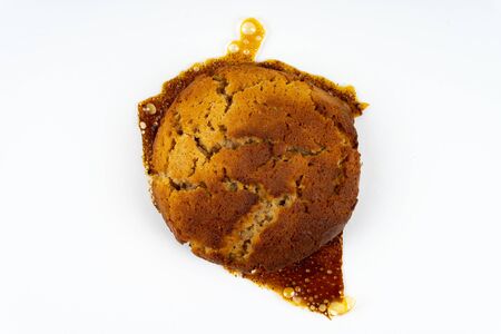 A cookie cake with peanut butter and caramel on white background with copy space - top viewの写真素材