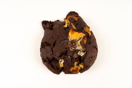 A cookie cake with chocolate on white background with copy space - top viewの写真素材