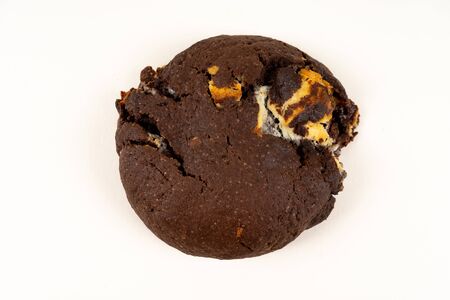 A cookie cake with chocolate on white background with copy space - angled viewの写真素材