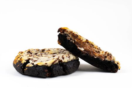 A cookie cake with chocolate on white background with copy spaceの写真素材