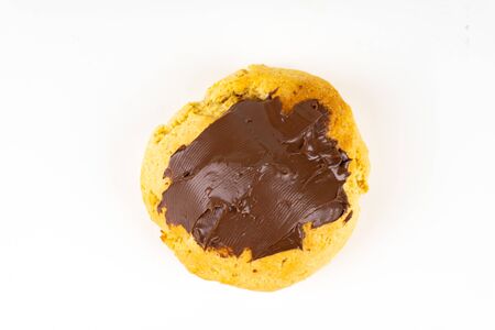 A cookie cake with chocolate on white background with copy spaceの写真素材