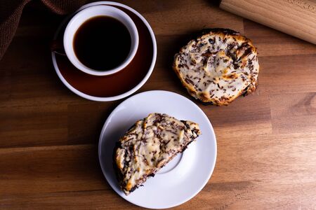 Delicious cookie cakes with chocolate and cheesecake with a cup of coffee on a wooden board with copy spaceの写真素材