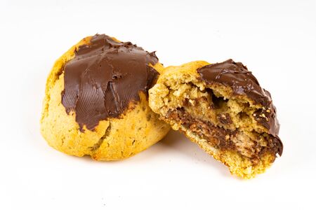 A cookie cake with chocolate on white background with copy spaceの写真素材