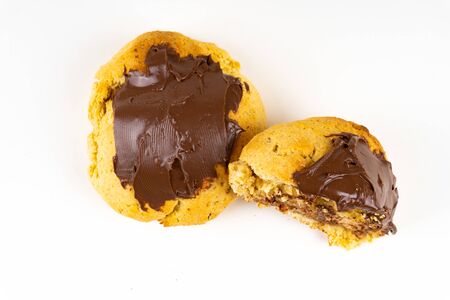A cookie cake with chocolate on white background with copy spaceの写真素材