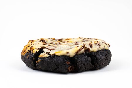 A cookie cake with chocolate on white background with copy spaceの写真素材