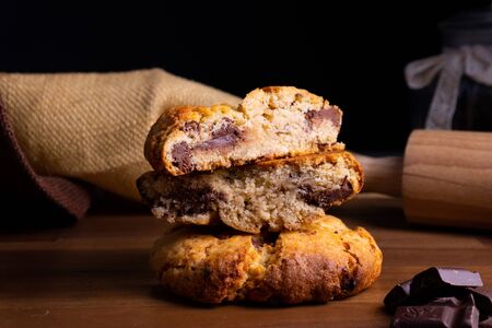 Two delicious cookie cakes with chocolate on a wooden board with copy spaceの写真素材