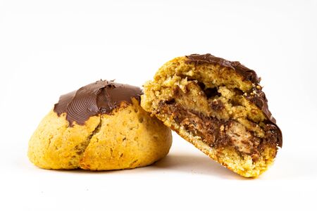 A cookie cake with chocolate on white background with copy spaceの写真素材