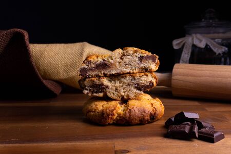 Two delicious cookie cakes with chocolate on a wooden board with copy spaceの写真素材