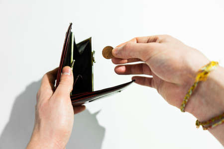 Hand holding Euro cent coin currency. Concept of povertyの写真素材