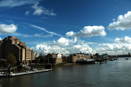 London river Thames with nice blue sky, white clouds and buildingの写真素材