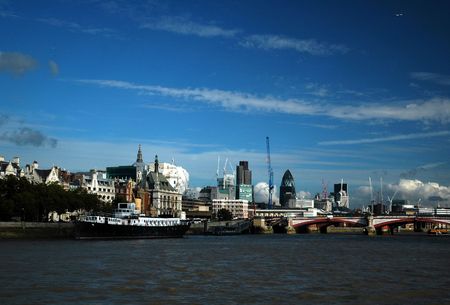 London river Thames with nice blue sky, white clouds and buildingの写真素材