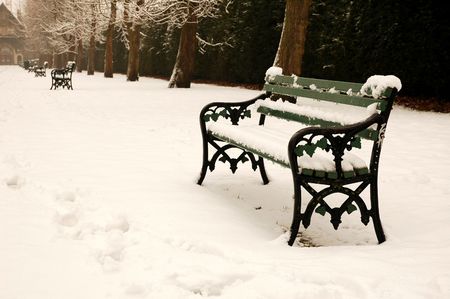  bench covered by snow, horizontally framed shotの写真素材