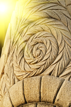 ancient style stone carving in sunestの写真素材