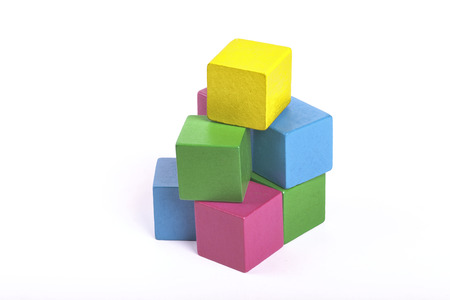 Colorful wooden building blocks isolated on white background
