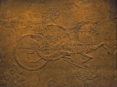 carvings in the walls at chinese temple. were representing using graphical such as horse, objects or...
