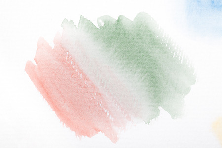 Pink and green gradient with the watercolor paint strokes on white background with space for your texts and imagesの写真素材