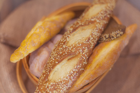 Fresh bread and wheat on bamboo basketの写真素材