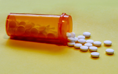 Opioid Crisis - Open Bottle of Prescription Painkiller Pills