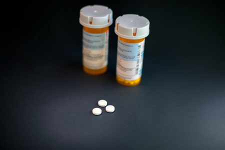 Opioid Crisis - Open Bottle of Prescription Painkiller Pillsの写真素材