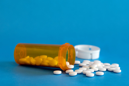 Open Bottle of Prescription Drugs on white with space for textの写真素材