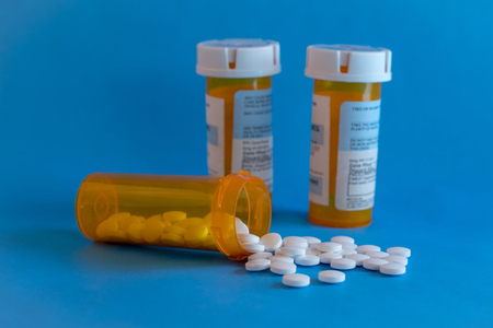 Opioid Crisis - Open Bottle of Prescription Painkiller Pillsの写真素材