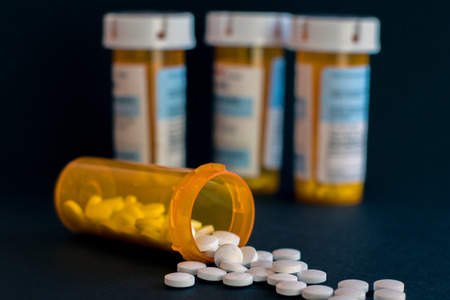 Opioid Crisis - Open Bottle of Prescription Painkiller Pillsの写真素材