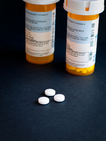 Opioid Crisis - Open Bottle of Prescription Painkiller Pillsの写真素材