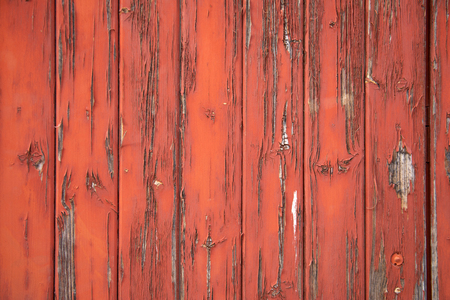 Close-up of chipping red paint on wood slatsの写真素材