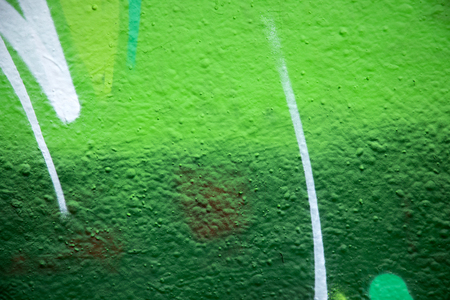 Close up of green paint on a cement wall, great background for designersの写真素材