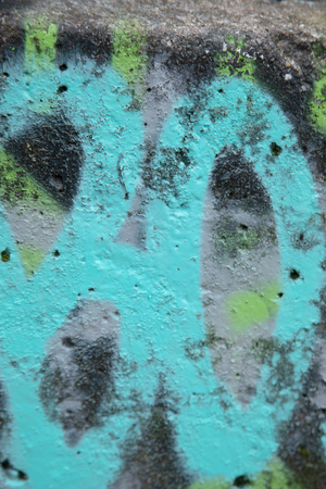 Close up of vandalism on a concrete wall, great background for designersの写真素材
