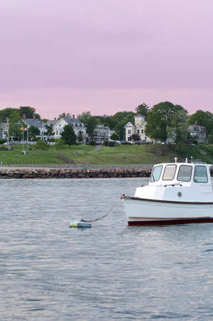 Small power boat off beach in harborの写真素材