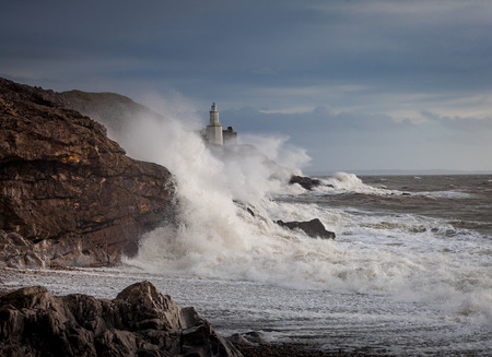 Storm Frank at Mumbles lighthouse and Bracelet Bay, Gower, Swansea.の写真素材