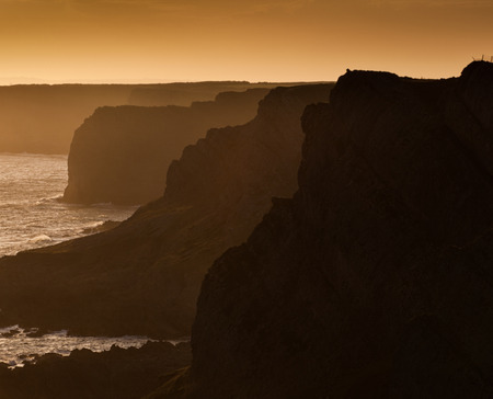 The dramatic and dangerous cliffs of the Gower peninsula in Swansea, South Wales.の写真素材