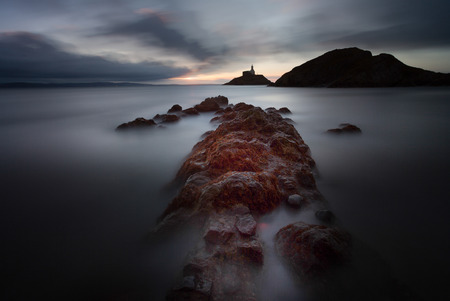 Morning at Mumbles lighthouse, an iconic structure in Swansea Bay, Swansea