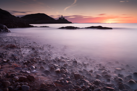 Pebbles at dawn on Bracelet Bay on the Gower peninsula, Swansea, UK.の写真素材