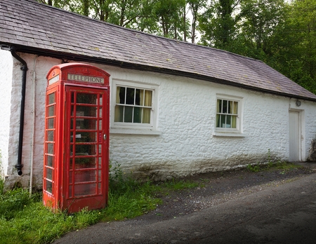 Editorial Cwmdu, UK - June 11, 2017: An old red british telephone box which can still be found in small villages in rural Wales, UK.のeditorial素材