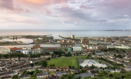 Editorial SWANSEA, UK - JUNE 4, 2017: Swansea city east shot from Kilvey Hill, showing the docks, the St. Thomas area and the marina with Mumbles in the far distance.のeditorial素材