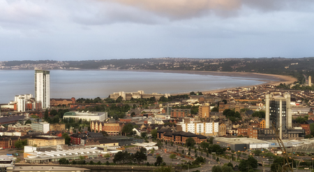 Editorial SWANSEA, UK - JUNE 4, 2017: A view taken from the Kilvey Hill on the East side SA1 area, the main approach into Swansea City, showing the bay, main town centre, leisure facilities and the Meridian Tower.のeditorial素材