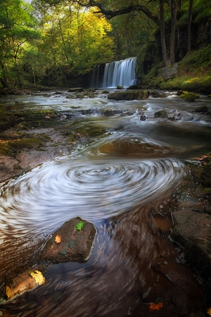 Sgwd Ddwli Uchaf waterfalls South Wales Swirling foam at the Sgwd Ddwli Uchaf waterfall on the river Neath, part of the waterfall country trail of falls, near Pontneddfechan in South Wales, UKの写真素材
