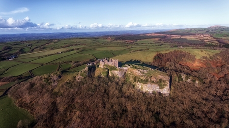 Carreg Cennen castle sitting high on a hill near the River Cennen in the village of Trapp, four miles South of Llandeilo in Carmarthenshire, South Wales, UKのeditorial素材