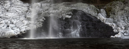 Henrhyd Falls, the highest waterfall in South Wales, during the 'Beast from the East' winter storms.の写真素材