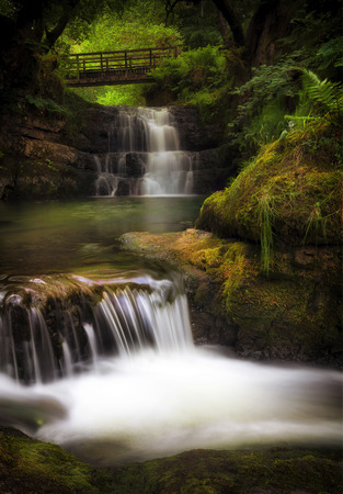 The Sychryd Cascades, (Sgydau Sychryd in Welsh) a set of waterfalls near the Dinas Rock,...
