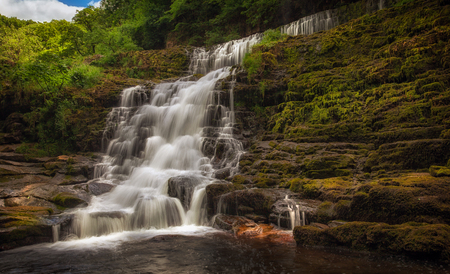 The top section of Sgwd Clun Gwyn waterfall from the west bank, on the Mellte river, near Pontneddfechan in South Wales, UK.の写真素材