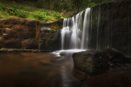 A waterfall at Blaen y Glyn. One of a series of closely connected waterfalls at Blaen y Glyn, near Merthyr Tydfil in the South Wales valleys, UKの写真素材
