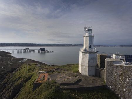 The iconic landmark that is Mumbles Lighthouse on the Gower peninsula in Swansea, South Wales, UK.の写真素材